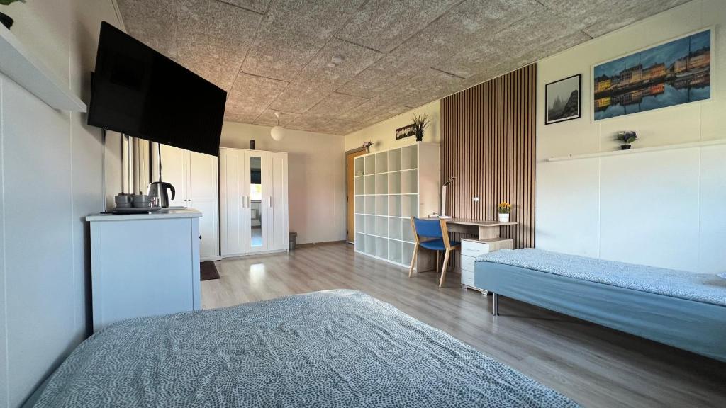 Ένα ή περισσότερα κρεβάτια σε δωμάτιο στο Pavillon Greve
