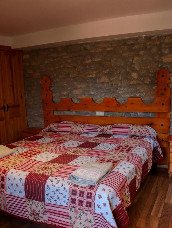 Postel nebo postele na pokoji v ubytování Las Bodegas De Claveria
