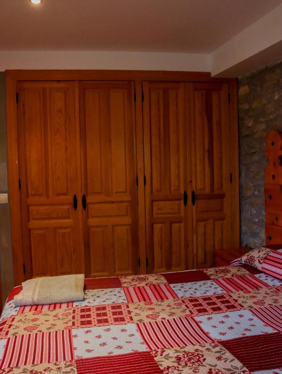 Postel nebo postele na pokoji v ubytování Las Bodegas De Claveria