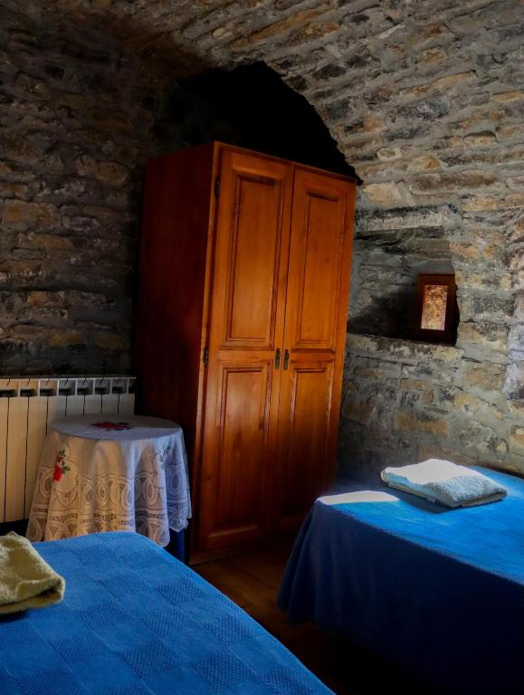 Postel nebo postele na pokoji v ubytování Las Bodegas De Claveria
