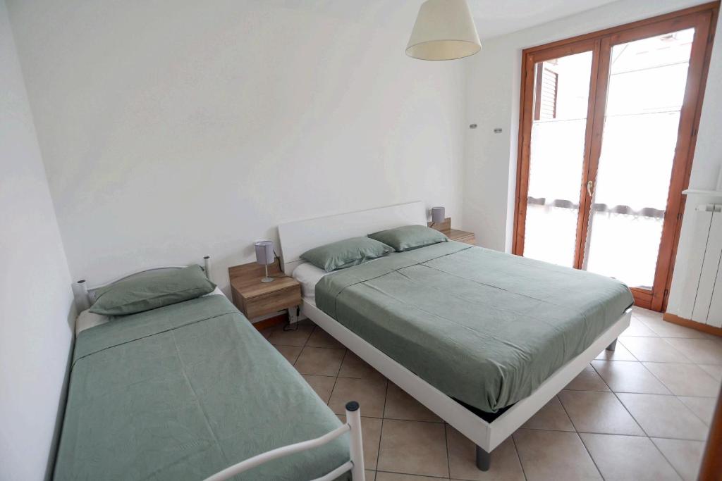 Postel nebo postele na pokoji v ubytování La casetta di Lorena
