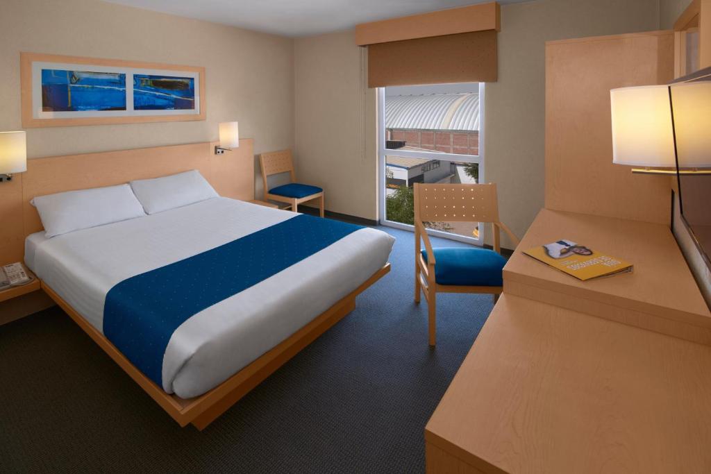 Cama o camas de una habitación en City Express by Marriott Puebla FINSA