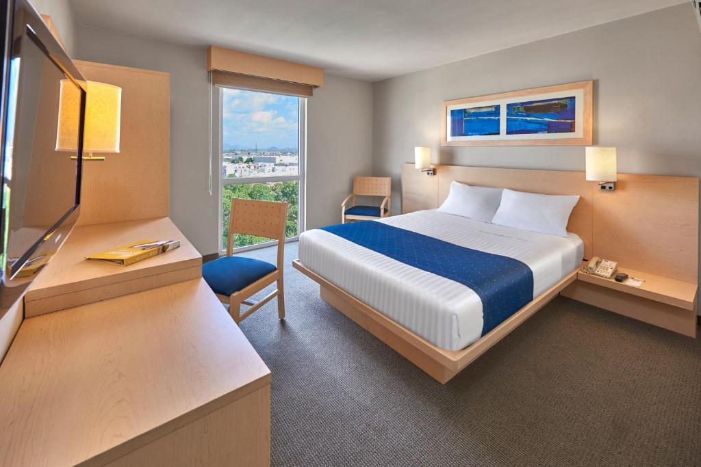 Cama o camas de una habitación en City Express by Marriott Puebla FINSA