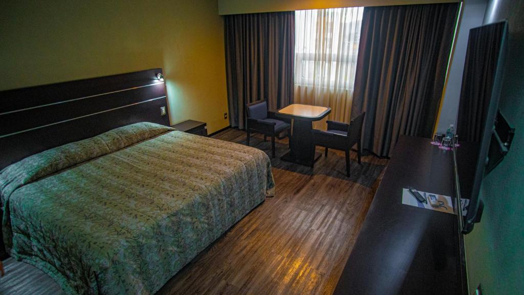 Postel nebo postele na pokoji v ubytování Hotel Parque Satelite