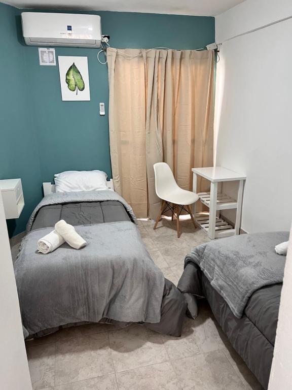 Ένα ή περισσότερα κρεβάτια σε δωμάτιο στο Hospedaje LH planta baja A