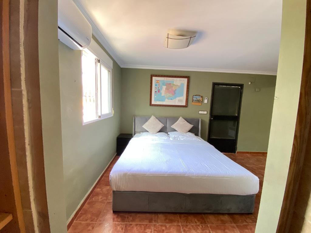 Ένα ή περισσότερα κρεβάτια σε δωμάτιο στο Guesthouse in Torrent