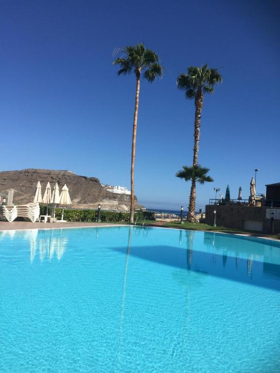 The swimming pool at or close to MOGAN PEARL - POOL - DOUBLE TERRACE - OCEAN VIEW - BEACH - WIFI - WONDERFUL Complex - FREE DIGITAL TRAVEL GUIDE