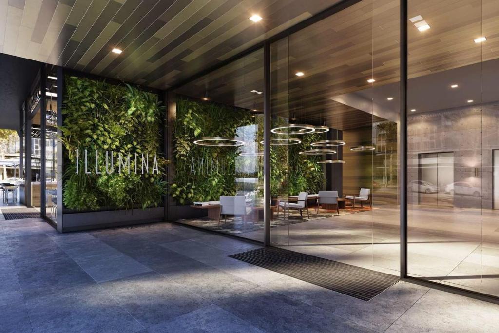 a lobby of a building with a green wall at Modern APT in Toowong with Mountain View in Brisbane