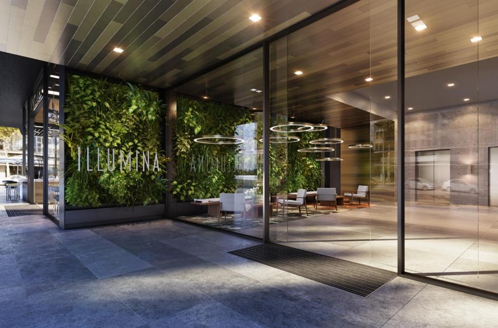 a lobby of a building with a green wall at Modern APT in Toowong with Mountain View in Brisbane