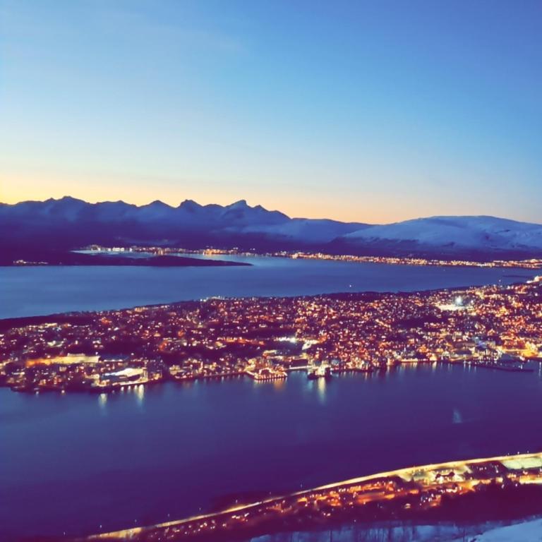 an aerial view of a city and a body of water at Comfy apartment in Tromsø in Tromsø