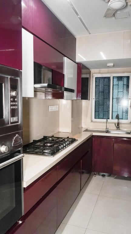 Kuchyň nebo kuchyňský kout v ubytování Zenith Homes - Powai Suites
