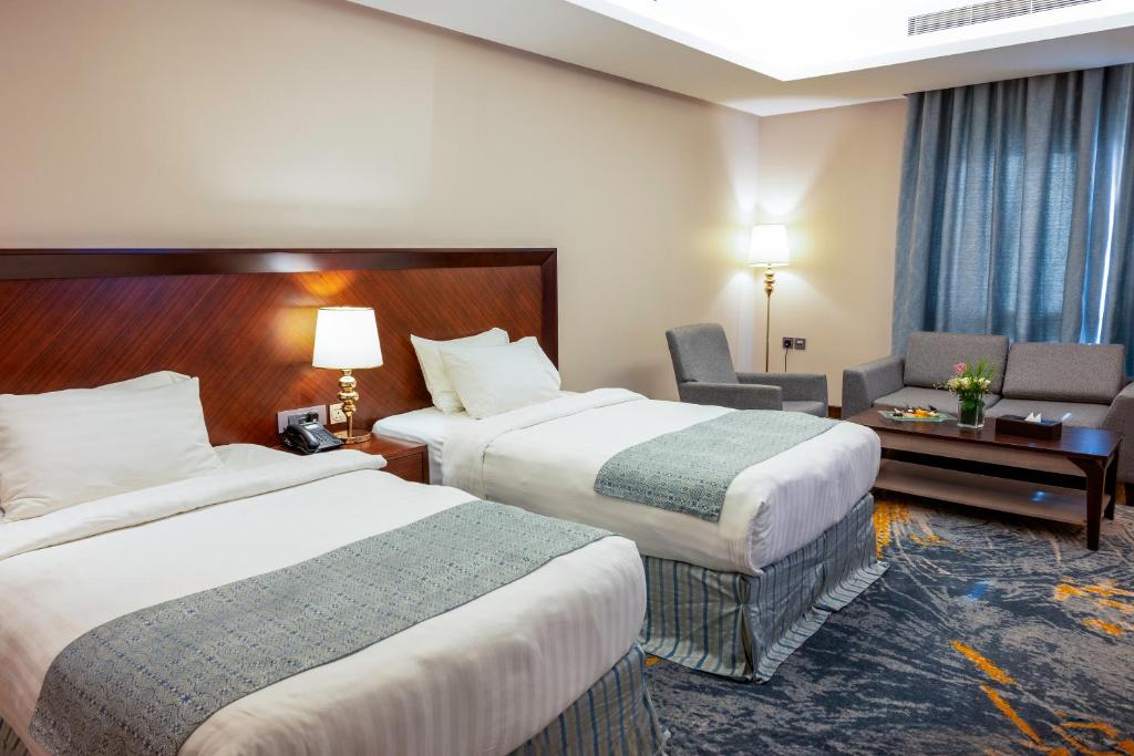 Postel nebo postele na pokoji v ubytování Ruve Jeddah Hotel