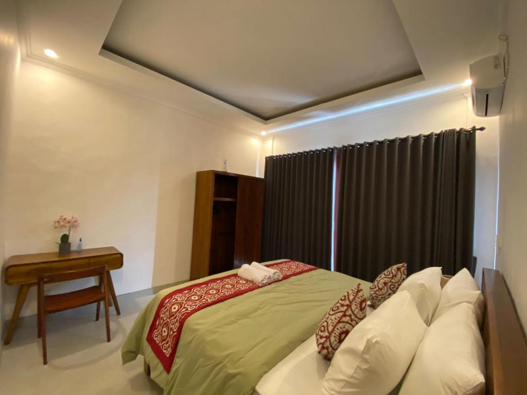 Postel nebo postele na pokoji v ubytování Roberto Suites Ubud View by EPS