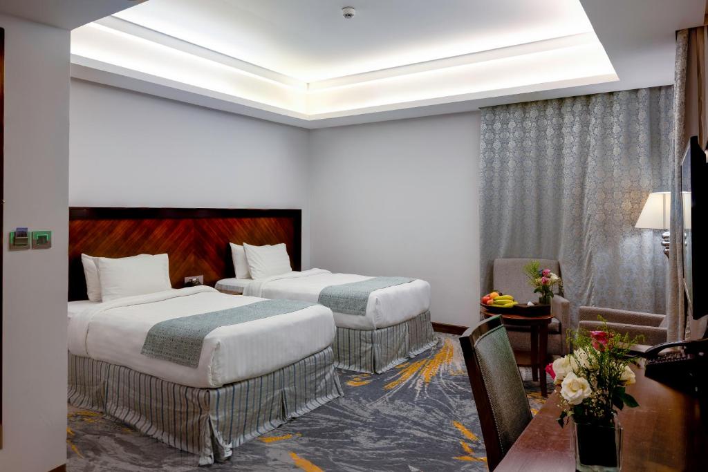 Postel nebo postele na pokoji v ubytování Ruve Jeddah Hotel