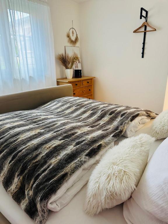 Postel nebo postele na pokoji v ubytování ALPEN WOHLFÜHLQUARTIER