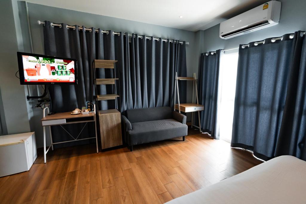 TV a/nebo společenská místnost v ubytování A Hotel Cozy