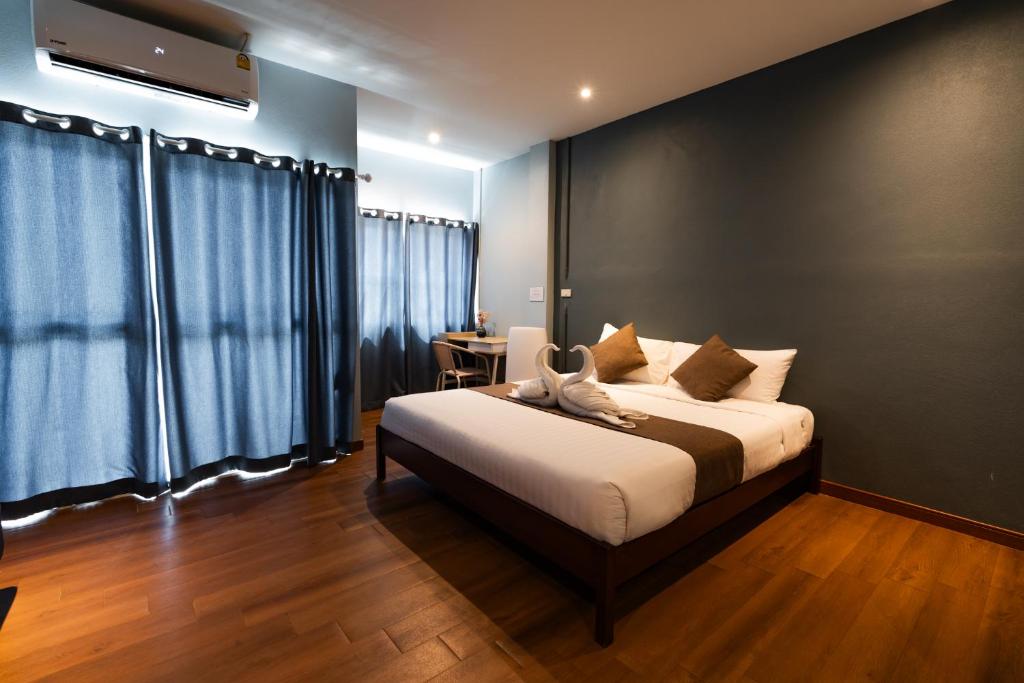 Postel nebo postele na pokoji v ubytování A Hotel Cozy