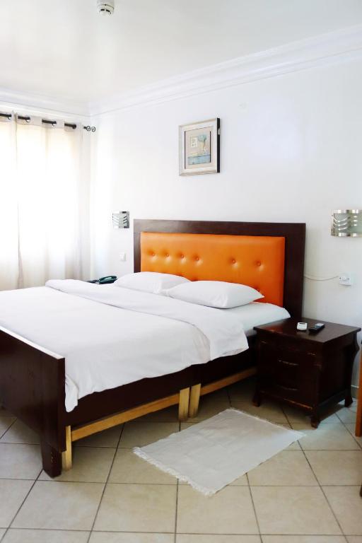 Ένα ή περισσότερα κρεβάτια σε δωμάτιο στο Cata Apartment Hotel And Spa