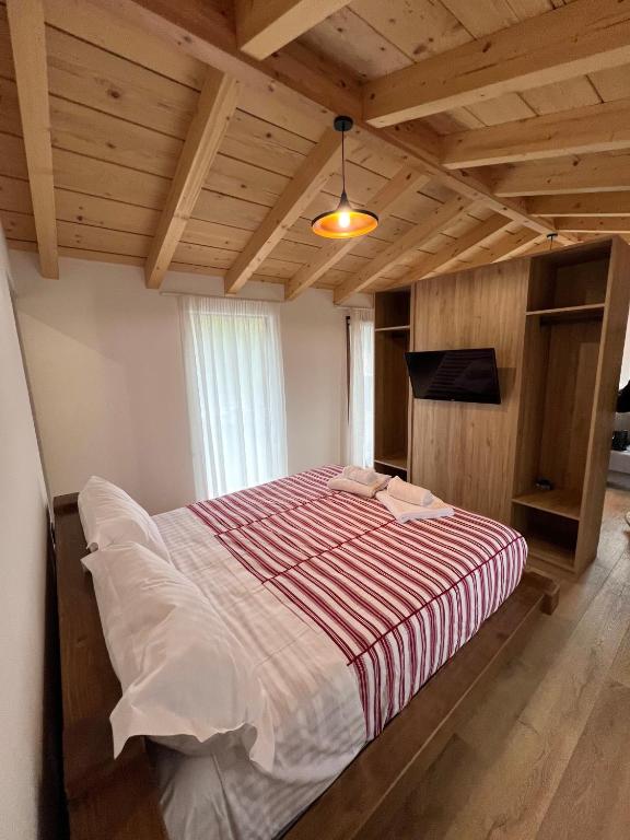 Postel nebo postele na pokoji v ubytování Guest House Si n'shpi tande - Mrizi i Zanave