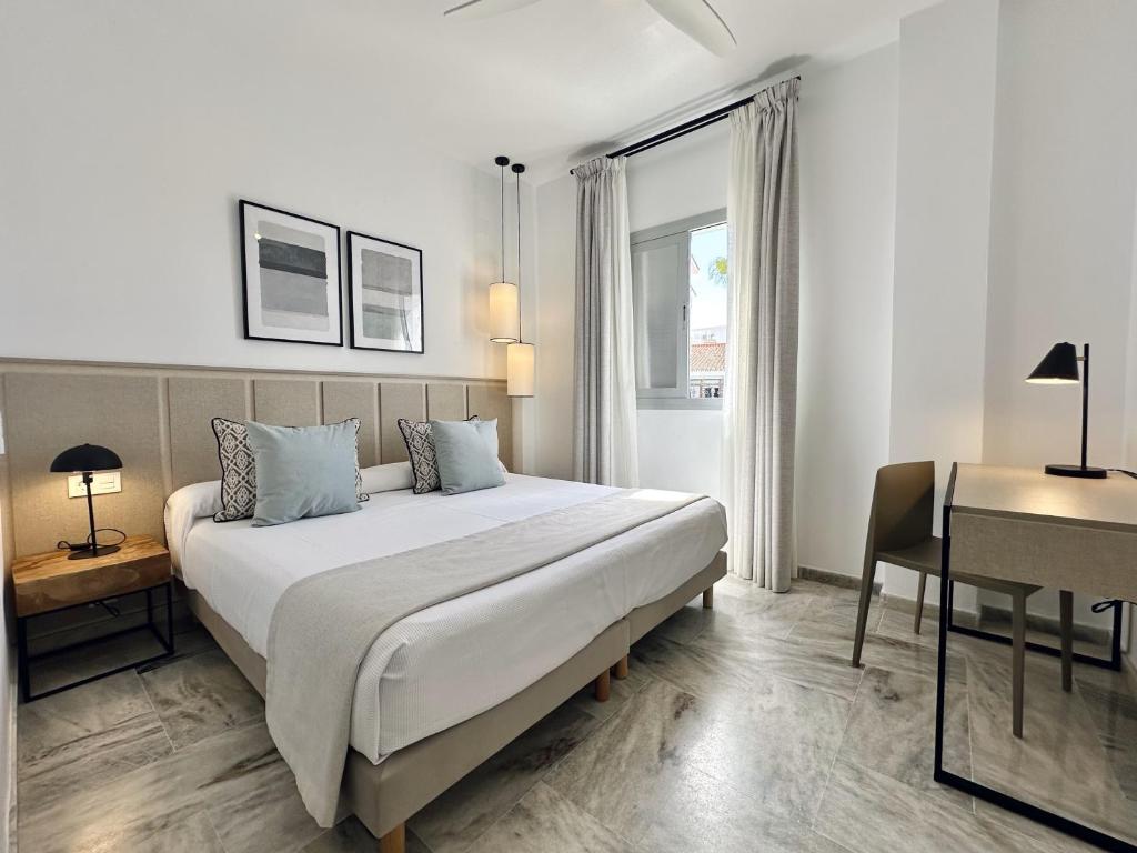 Posteľ alebo postele v izbe v ubytovaní Hotel Apartamentos Marina Luz