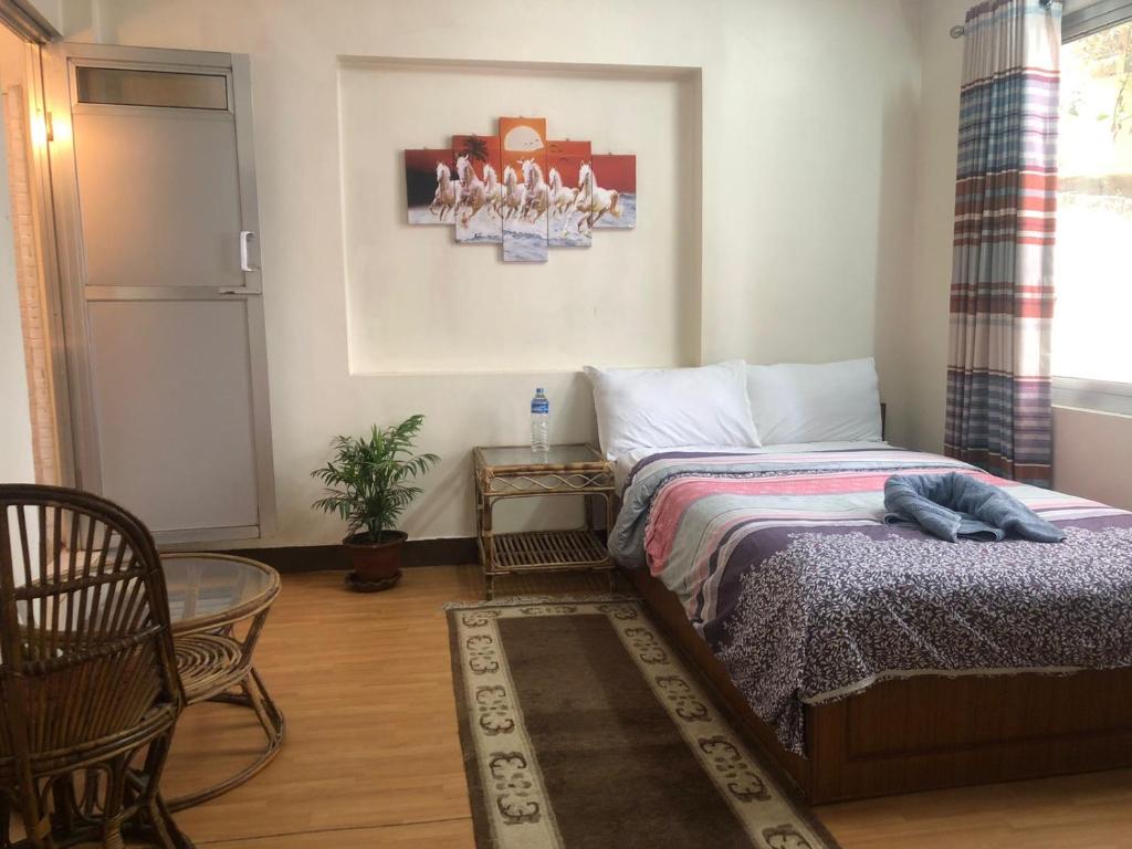 Postel nebo postele na pokoji v ubytování Green Mandala Inn