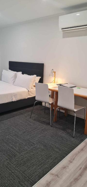 Postel nebo postele na pokoji v ubytování Alpine Chalets