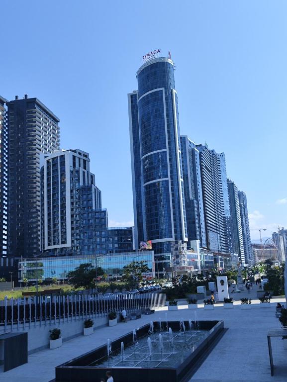 a view of a city with tall buildings at Batumi Luxury Panoramic Sea View Apartment in Angisa