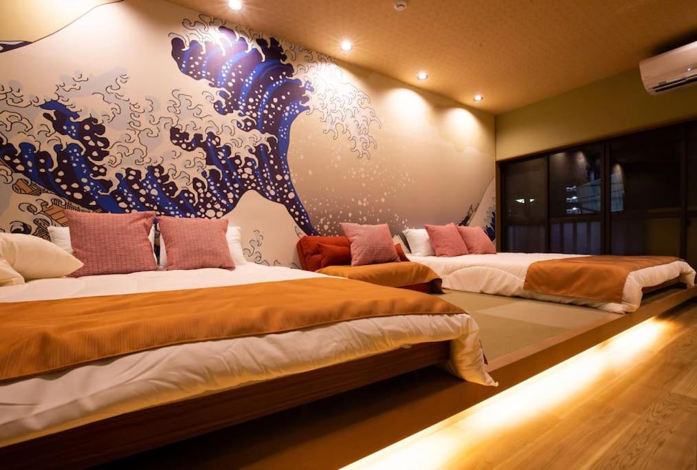 Ένα ή περισσότερα κρεβάτια σε δωμάτιο στο unito 青砥