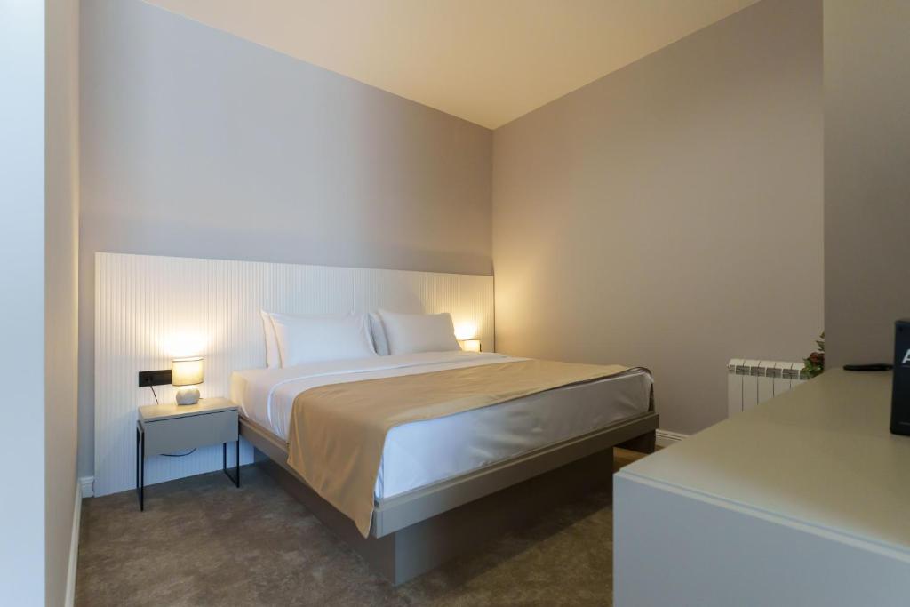 Postel nebo postele na pokoji v ubytování Move In Apartments