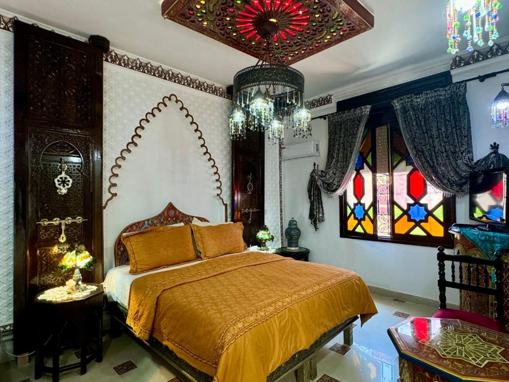 Postel nebo postele na pokoji v ubytování Riad Mogador