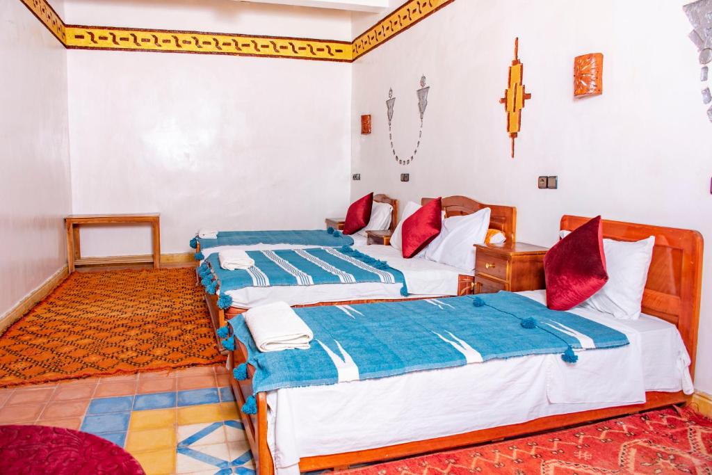 Postel nebo postele na pokoji v ubytování Hotel Awayou