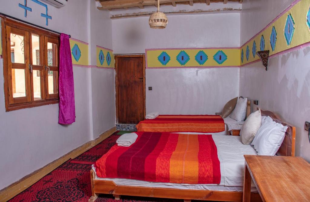 Postel nebo postele na pokoji v ubytování Hotel Awayou