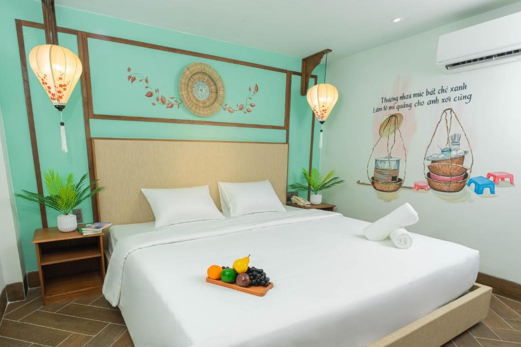 Giường trong phòng chung tại Sujet Hotel Da Nang