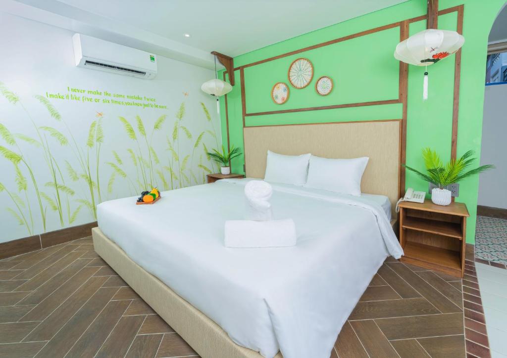Giường trong phòng chung tại Sujet Hotel Da Nang