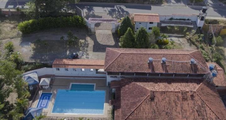 an overhead view of a house with a swimming pool at Hotel Campestre La Ribera del Fonce in San Gil