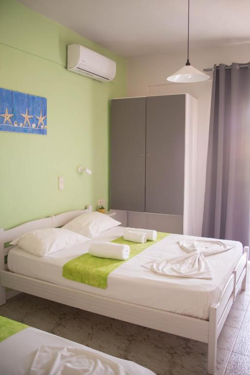 Posteľ alebo postele v izbe v ubytovaní Nereides Hotel