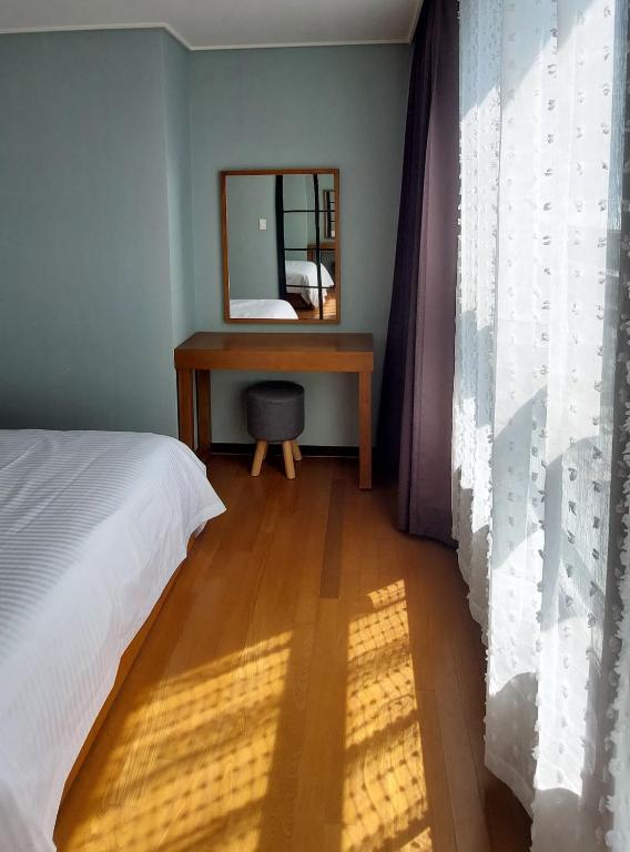 Postel nebo postele na pokoji v ubytování 바다스테이18