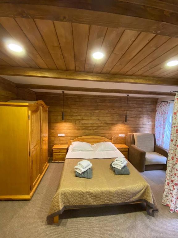 Postel nebo postele na pokoji v ubytování GORGANY resort & SPA