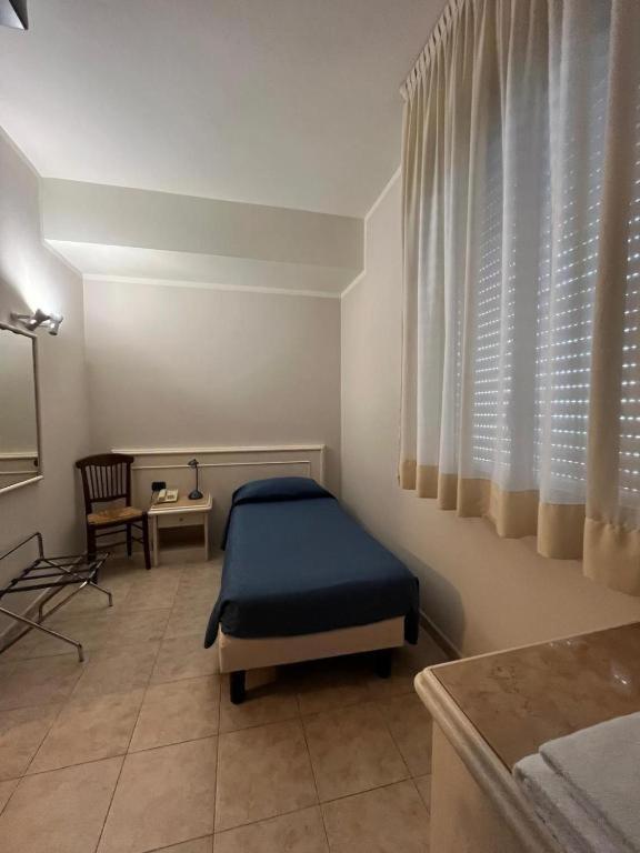 Postel nebo postele na pokoji v ubytování Hotel Classicano
