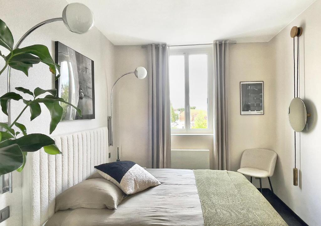 Postel nebo postele na pokoji v ubytování Les Alcoves - Studios design