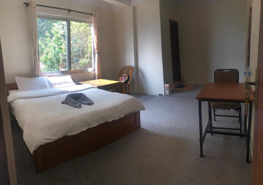 Postel nebo postele na pokoji v ubytování Green Mandala Inn
