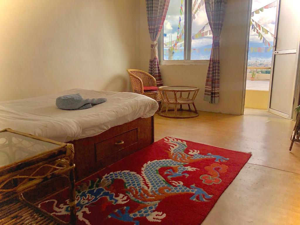 Postel nebo postele na pokoji v ubytování Green Mandala Inn