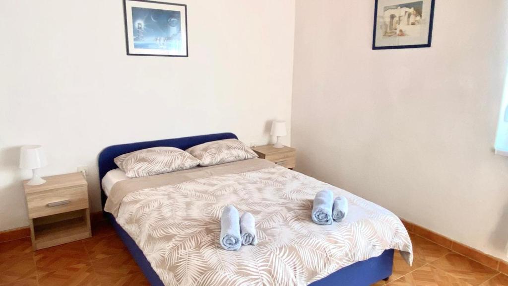 Postel nebo postele na pokoji v ubytování Ždrelac Guest House