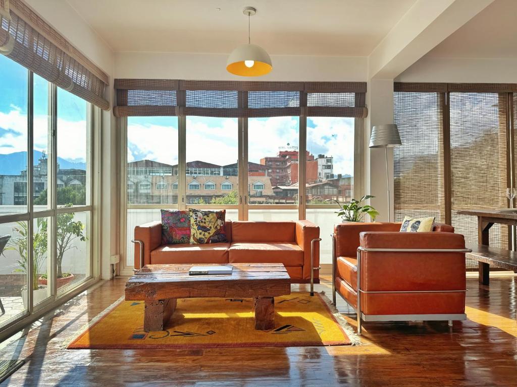 a living room with a couch and a table at Ananya Apartments Phase 1 in Kathmandu