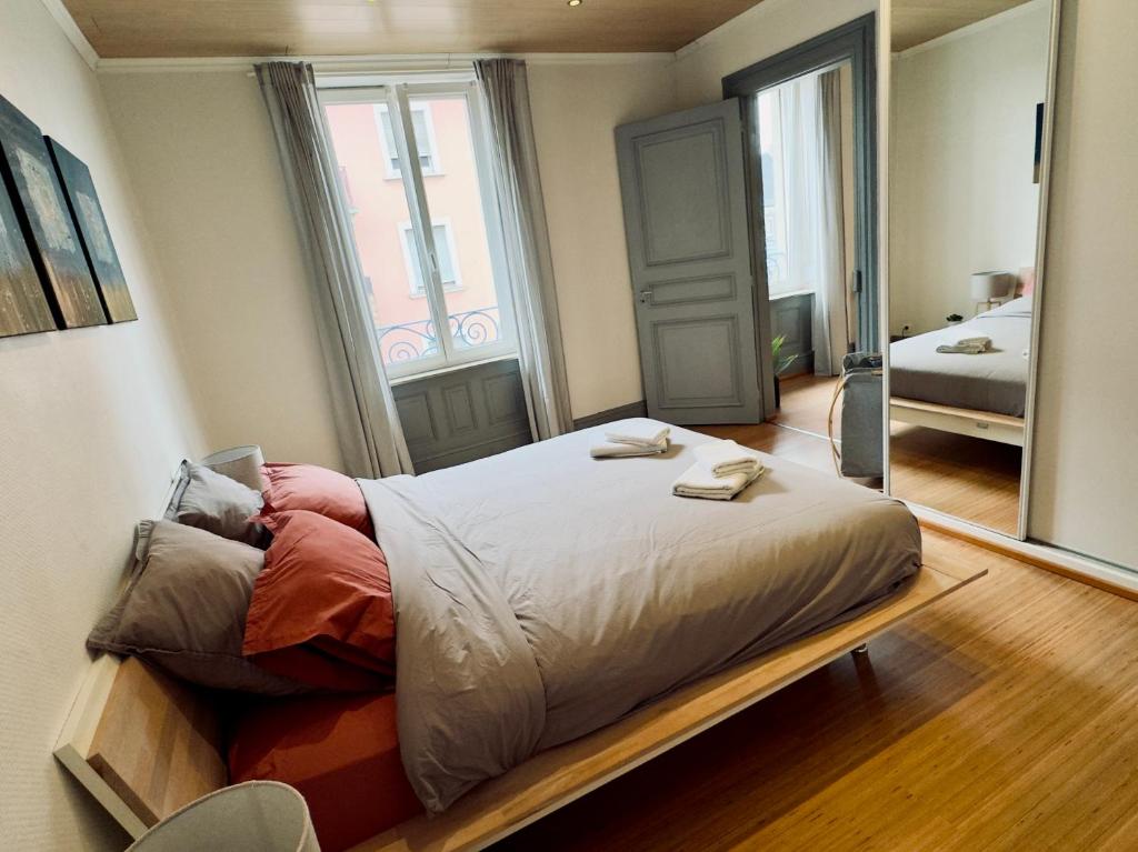 Posteľ alebo postele v izbe v ubytovaní Jadore - Appartements meublés Mulhouse Ville