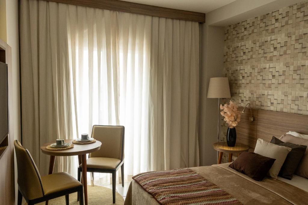 Postel nebo postele na pokoji v ubytování Flat Fusion Itaguaí - Conforto e Conveniência em Frente à Rodoviária, na linda Costa Verde - Sua Estadia Perfeita!
