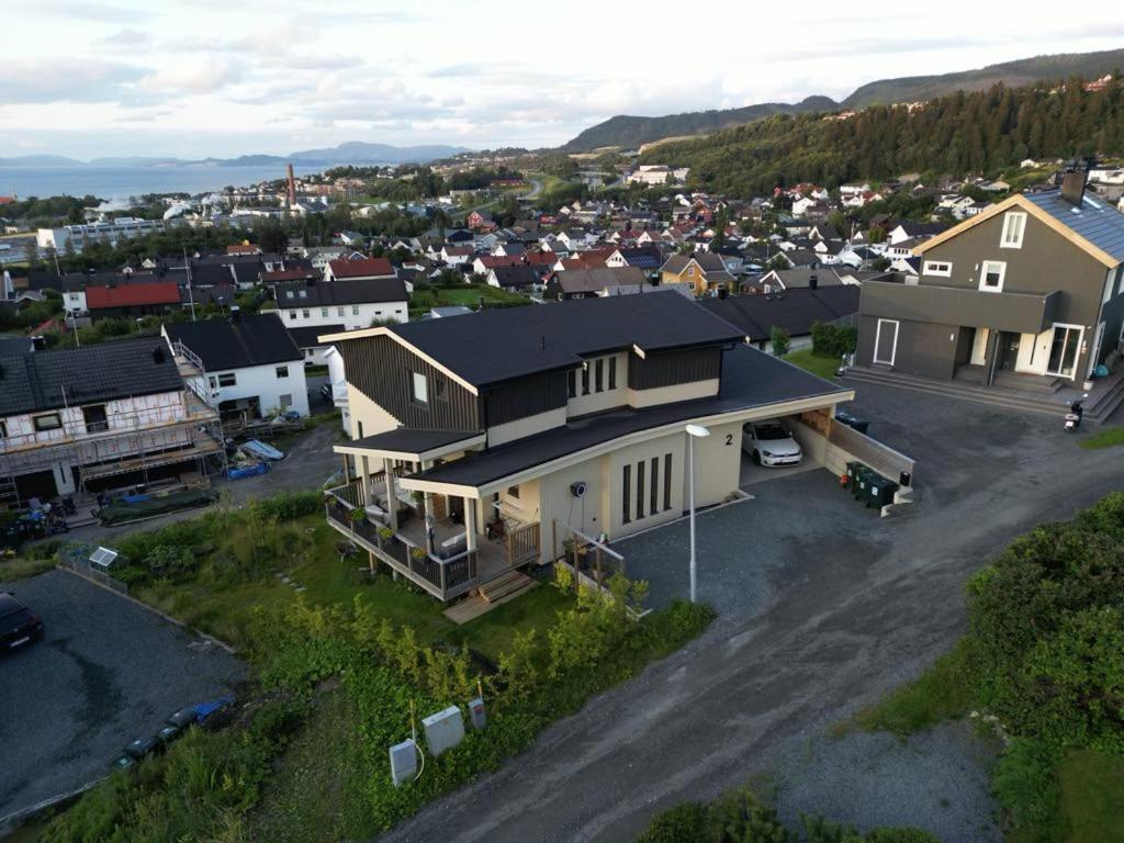 an aerial view of a house in a town at New and trendy home with fjord view in Ranheim