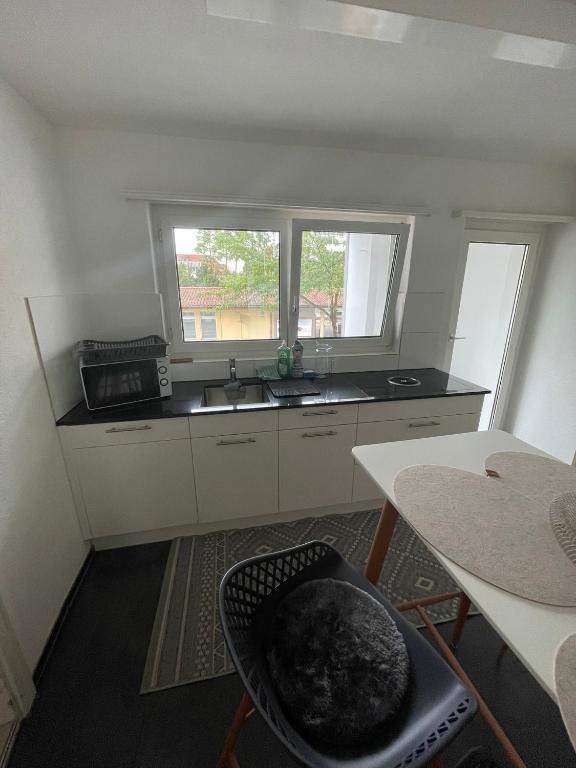 Kuchyň nebo kuchyňský kout v ubytování MTL Schweiz Apartments