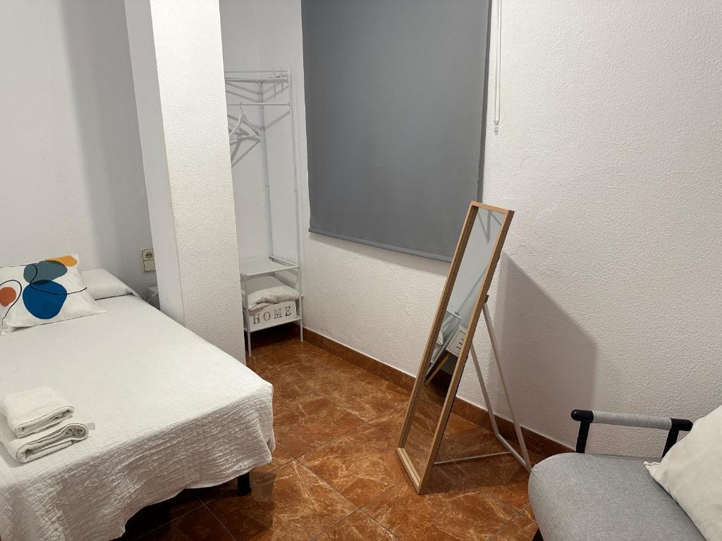 Posteľ alebo postele v izbe v ubytovaní Apartamentos & Rooms JP