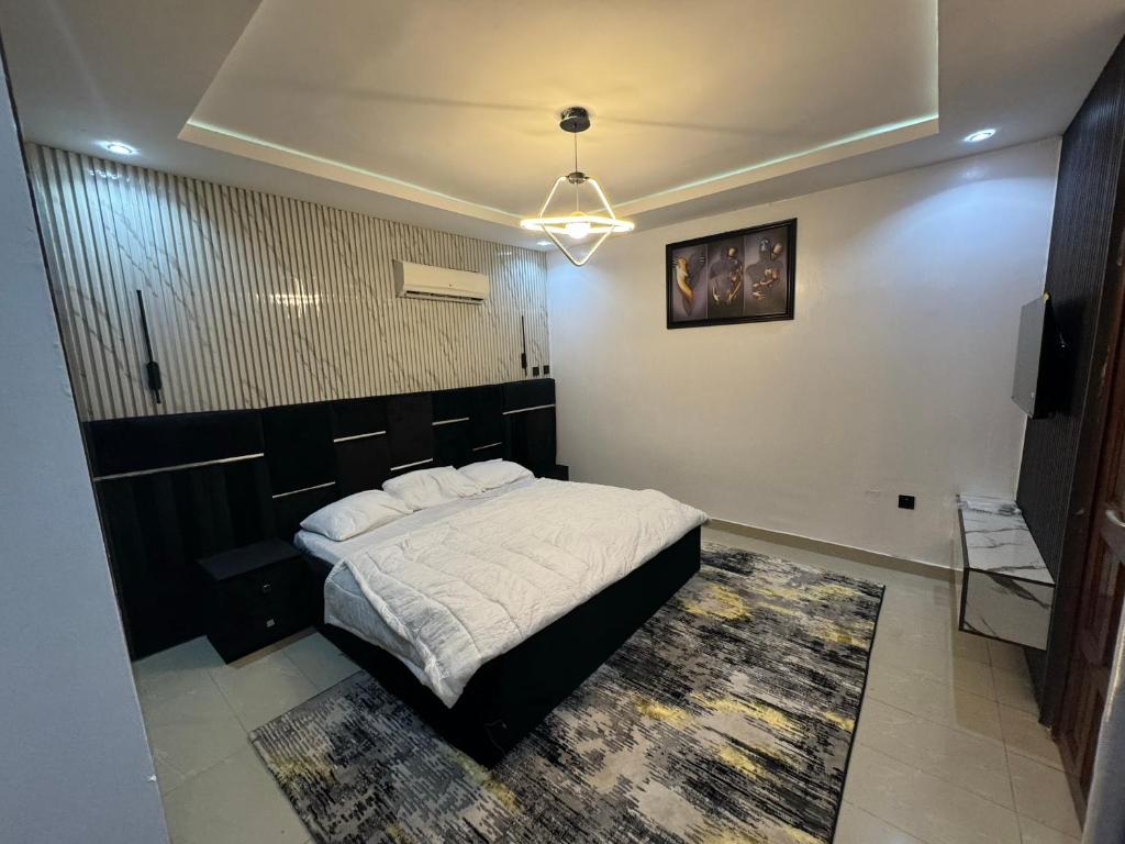Postel nebo postele na pokoji v ubytování Cozy Ambience 1